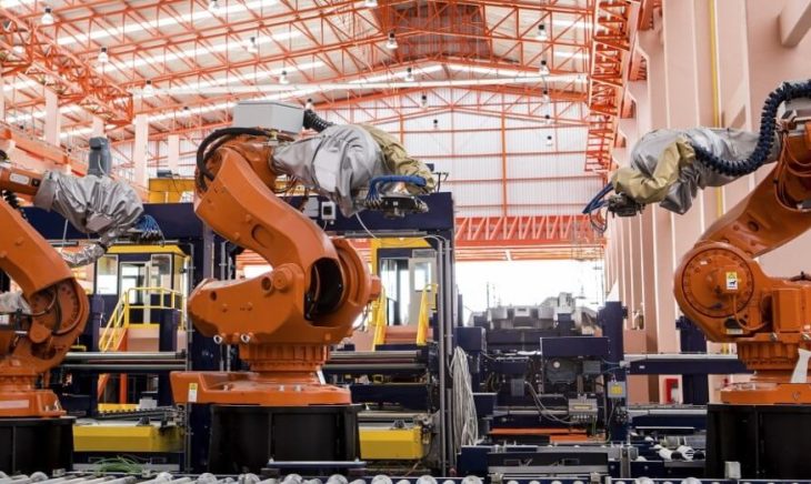 Robots welding in a production line